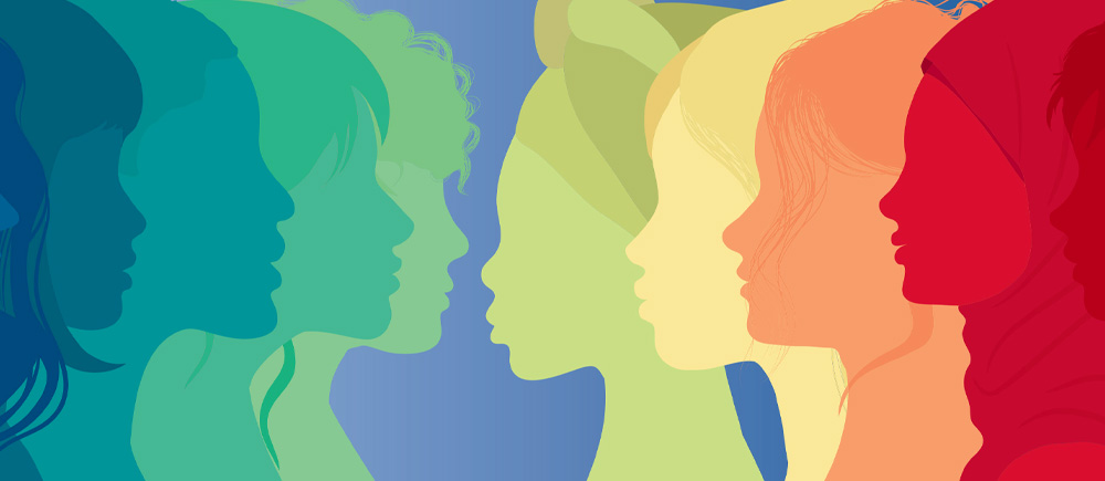  A colorful silhouette of women of various races depicted in shades of red, orange, yellow, green, and blue, celebrating diversity and inclusion.